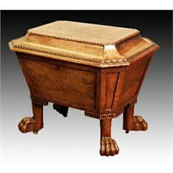 A George IV mahogany sarcophagus shaped cellaret, satinwood banding to lid, fluted moulding above