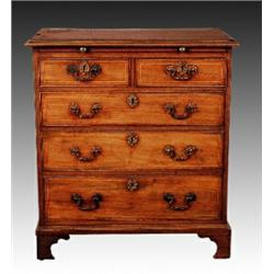 A George III mahogany and satinwood inlaid chest, circa 1790, fitted with brushing slide, two sho