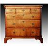 Image 1 : A late George II walnut and feather banded chest, canted fluted corners flanking three short and