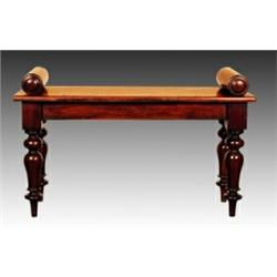 A William IV mahogany window seat, circa 1830-35, the rectangular moulded seat between two turned