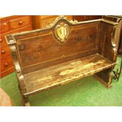 Small oak settle, 52" wide with armorial crest and acanthus leaf decoration…