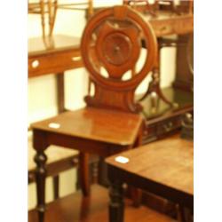 Victorian mahogany hall chair with round shaped back and English rose decoration to centre…