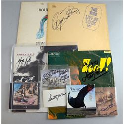 A collection of signed items including LP sleeves /