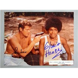 Roger Moore & Gloria Hendry, a signed photograph print