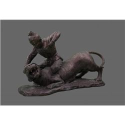 Antique bronze sculpture of a man wrestling a Tiger.
