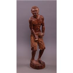 Wood Carving of a man.  Signed "Javi".  Size: 28" x 8"