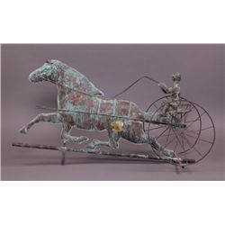 Horse and jockey weathervane.  Has green patina with