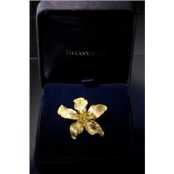 TIFFANY AND CO. 18 KARAT GOLD AND DIAMOND BROOCH...