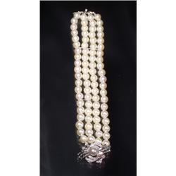 4 STRAND PEARL AND DIAMOND 14K BRACELET...