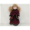 Image 1 : PORCELAIN DOLL IN VELVET WINTER DRESS