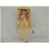 Image 1 : PORCELAIN DOLL IN PEACH DRESS