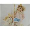 Image 2 : PORCELAIN DOLL ON CAROUSEL HORSE