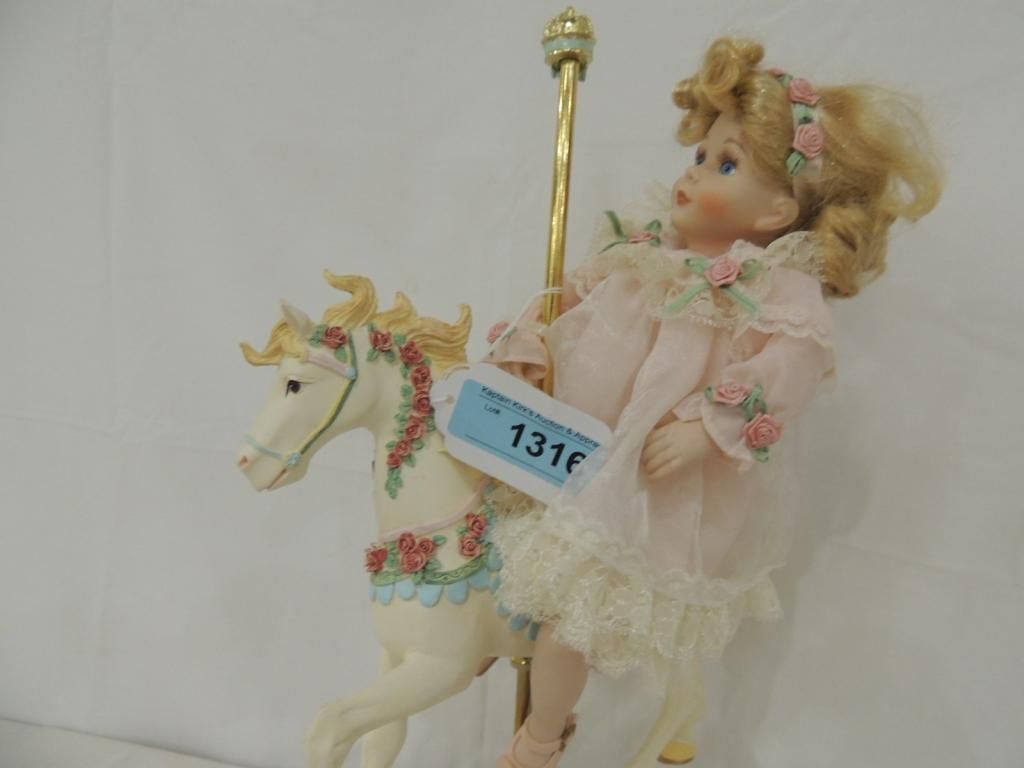 porcelain doll on carousel horse
