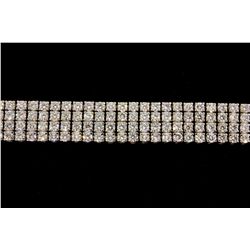 BRACELET: [1] 14kwg (stamped) and dia bracelet 8 1/2" long x 1/2" wide. Prong set with (236) 3.0 - 3