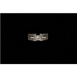 RING: [1] Ladies dia and 14kwg engagement ring. Center dia is princess cut 4.8mm x 4.9mm x 4.0mm app