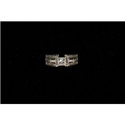 RING: [1] Ladies dia and 14kwg engagement ring. Center dia is princess cut 4.8mm x 4.9mm x 4.0mm app