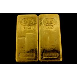 BULLION: [2] One kilogram Johnson Matthey .9999 fine gold bars.