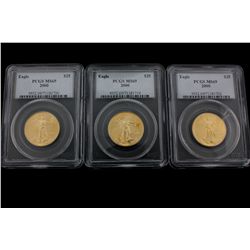 COINS: [3] $25 American Eagle gold coins, 1/2 oz, slabbed and graded PCGS MS69, 2000.