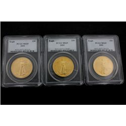 COINS: [3] $50 American Eagle gold coins, 1 oz, slabbed and graded PCGS MS69, 2000.