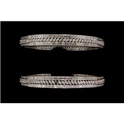 BRACELETS: [2] 18kwg dia bangles. Each has approx. (310) baguette dias and (93) marquise cut dias SI