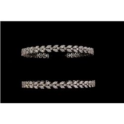 BRACELETS: [2] dia and 14kwg bangles. Each is set with (76) marquise cut dias and (38) rbc dias SI2 