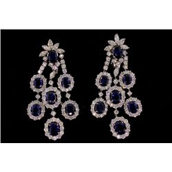 EARRINGS: [1] Pair 18kwg sapphire and dia dangle earrings set with (14) 8.00mm x 6.00mm oval faceted