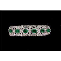 BRACELET: [1] 18kwg emerald and dia bangle prong set with (6) 6.00mm x 4.00mm rectangular emeralds, 