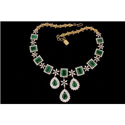 NECKLACE: [1] 18kyg necklace 20" long (9) emerald cut emeralds, (3) pear shaped emeralds, commercial