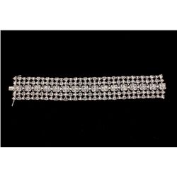 BRACELET: [1] Ladies 18kwg diamond bracelet 6 3/4" long x 1" wide. (128) rose cut dias (208) rbc dia