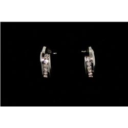 EARRINGS: [1] Pair ladys 14kw diamond "J" loop earrings; channel set 12 rb dias, 3.0mm-3.1mm = est 1