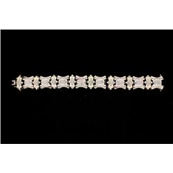 BRACELET: [1] 14kwg and diamond link bracelet, 8 1/4" long x 20.3mm wide, set with (368) invisibly s