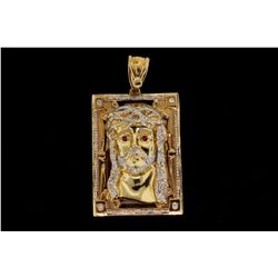 PENDANT:  [1] 10KYG Jesus pendant set with 2 synthetic red stones and 313 round diamonds, approx. 2.
