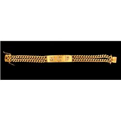 BRACELET:  [1] 14KYG and rhodium plated curb link chain ID bracelet with the initials  MCP  set with