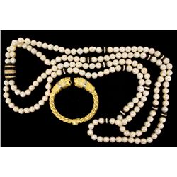 NECKLACE: [1] Double strand necklace of slightly baroque 9 to 10mm pearls that have blemishes and 12