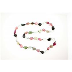 NECKLACE: [1] Single strand necklace of assorted colors of tourmaline and aquamarine beads with a 14