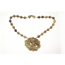 NECKLACE: [1] Single strand necklace of 14mm brownish green hard stone beads with small brass beads 