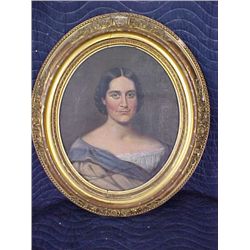 Early oil painting in oval frame of woman