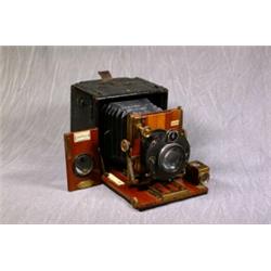 A Brass and Mahogany 1/4 Plate Camera in Linen Covered Case "The Sanderson By H.Ltd, London" with...