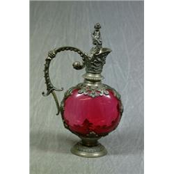 A Continental Cranberry Glass Wine Carafe with Pretty Plated Mount Handle and Cherub Stopper on C...