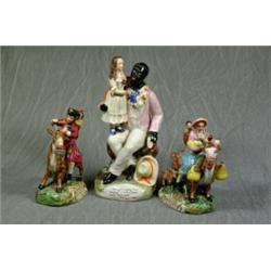 A Rare Staffordshire Figure "Uncle Tom and Eva". "Eva Gaily Laughing was Hanging a Wreath of Rose...