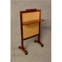 A Late Victorian Mahogany Fire Screen with Folding Shelf and Embroidered FoliateCentre Est. 100-2...