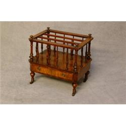 A Victorian Walnut Veneered Canterbury with Spindle Supports, Drawer to Base. On Castors. Est. 25...