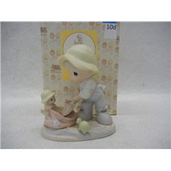 "Nothing Can Dampen the Spirit of Caring" Precious Moments Porcelain Figurine