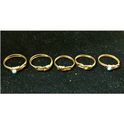 Five brass wire and turquoise rings