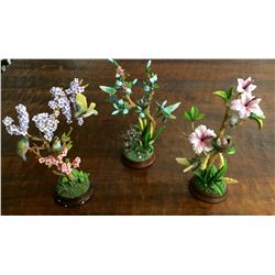 Three nature scene statues