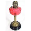 Image 1 : Brass oil lamp with cranberry bowl, on an opaque glass base, 46cm high…