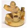 Image 1 : Carved ivory Okimono modelled as a seated lady stirring a pot, 6cm high…