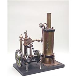 A brass and iron stationary engine, features include single cylinder, 8.25ins. grooved, flywheel,...