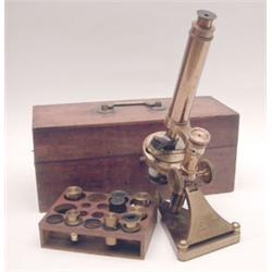 An R & J Beck lacquered brass microscope, no. 10247, with rack and micro focusing and substage mi...