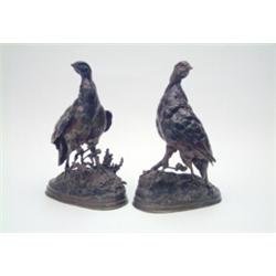 A pair of bronze partridge models after J.Moigniez, each on foliated mound bases, brown patinatio...